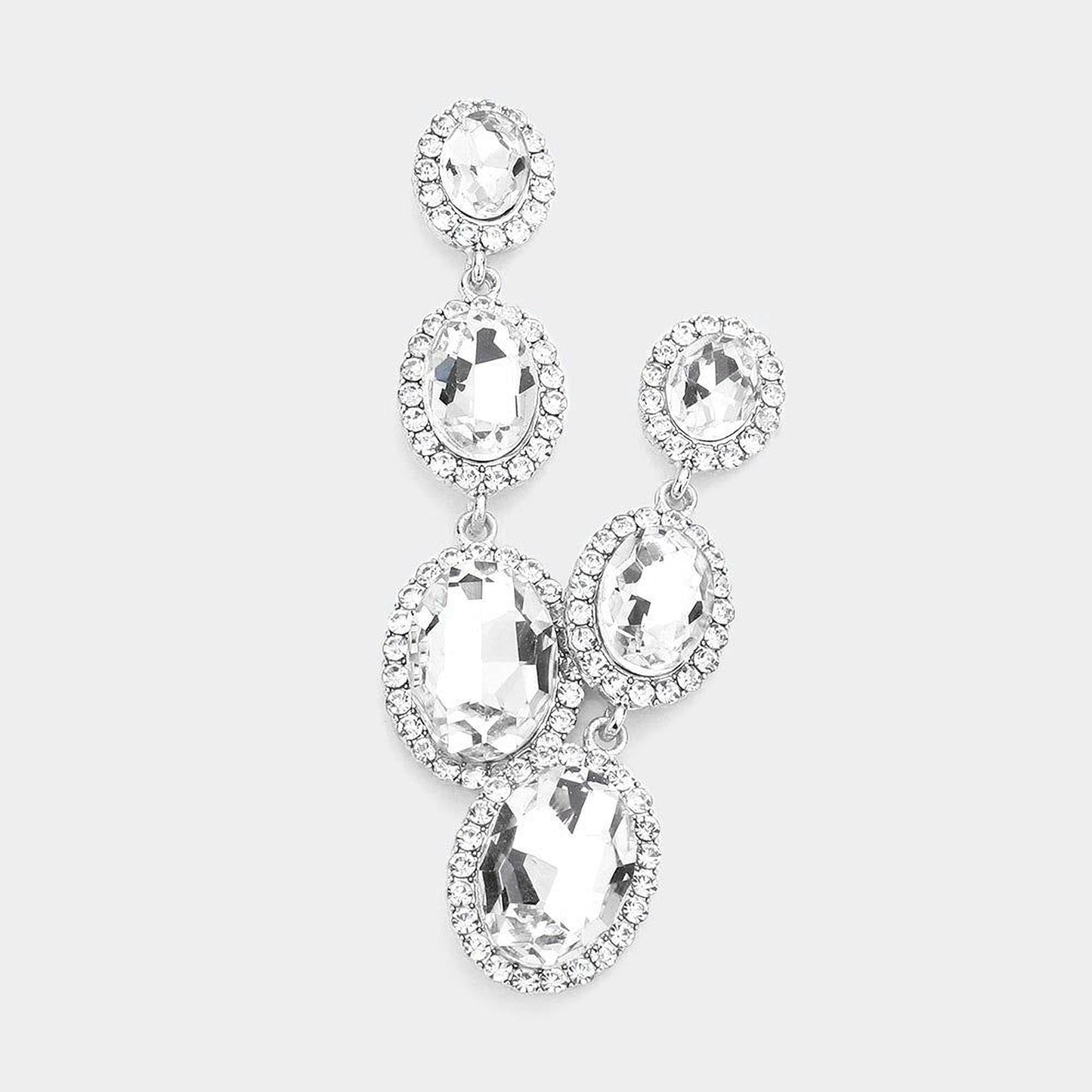 A pair of elegant earrings with large, clear gemstones set in a halo-like design.