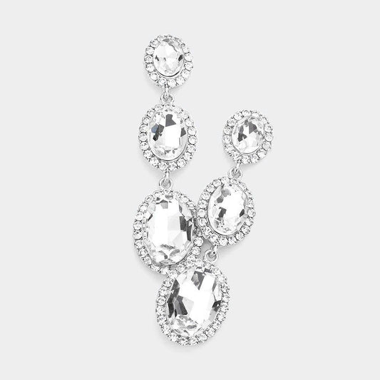 A pair of elegant earrings with large, clear gemstones set in a halo-like design.